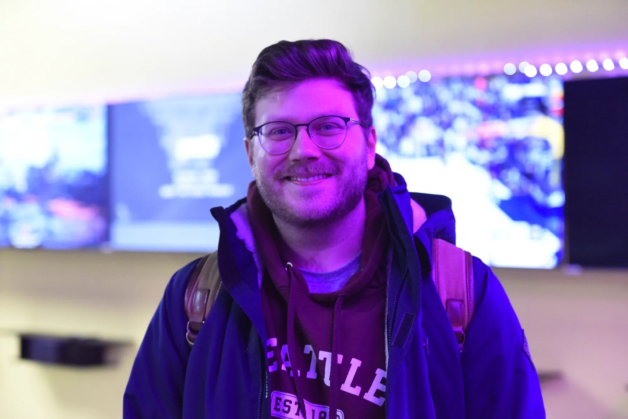 Olympus staff member smiling in the lounge